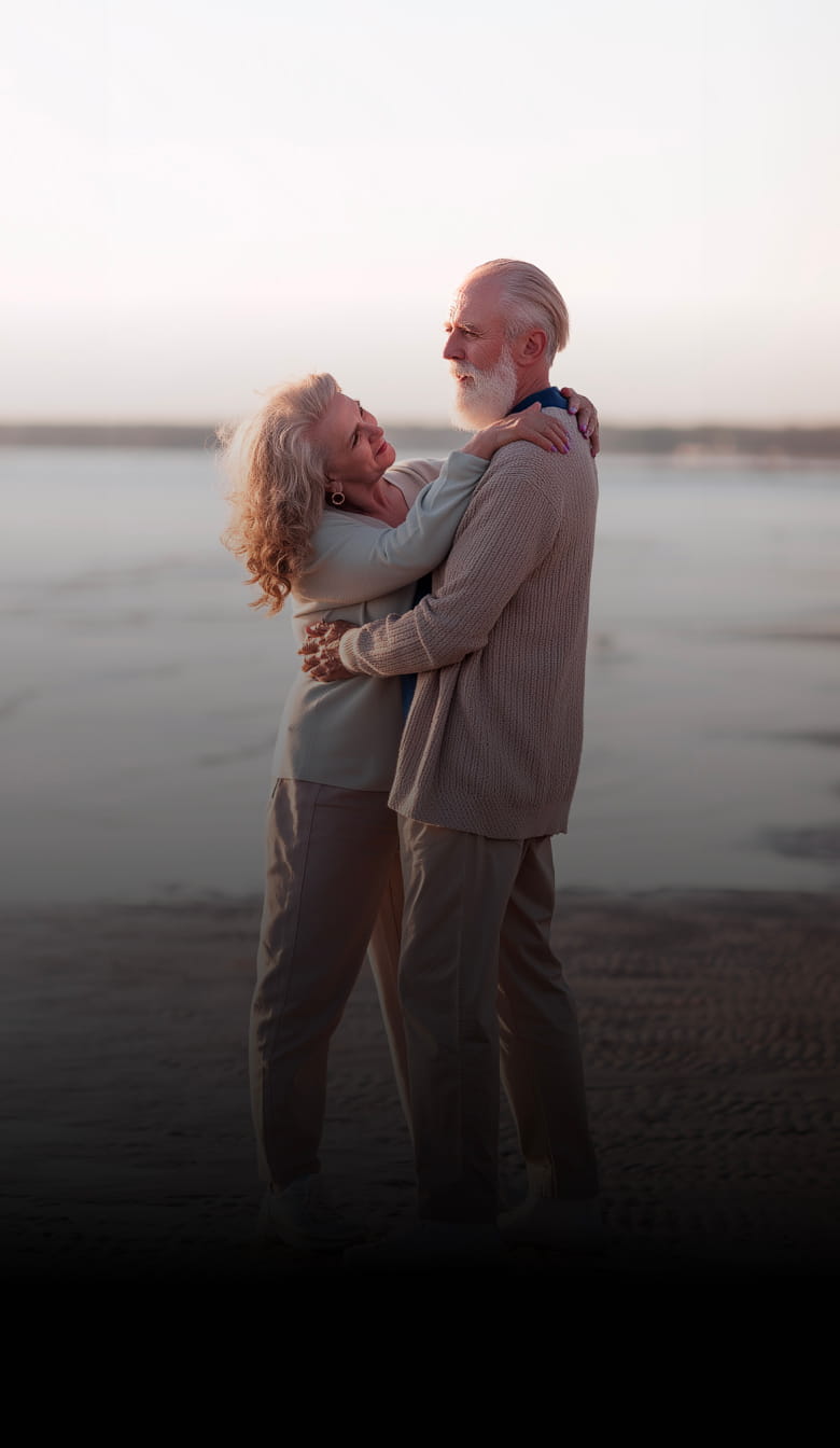 Elderly couple embracing at sunset — Sequel, curated dating app for modern elders